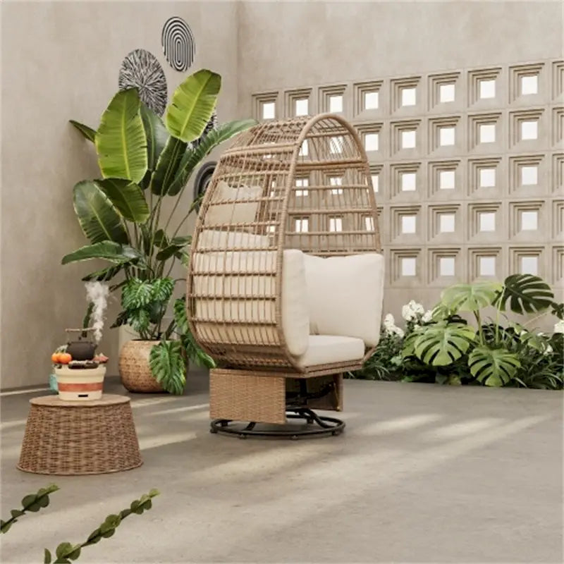 Fauteuil pivotant œuf en rotin pour terrasse, avec coussins et fonction bascule