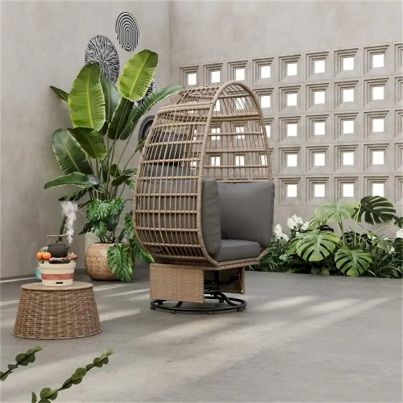 Fauteuil pivotant œuf en rotin pour terrasse, avec coussins et fonction bascule