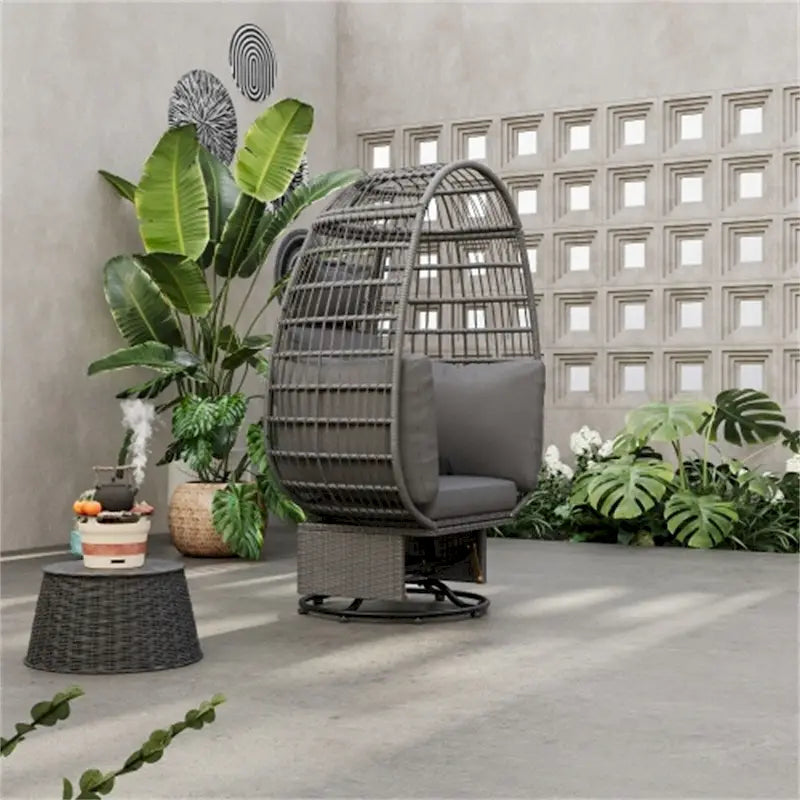 Fauteuil pivotant œuf en rotin pour terrasse, avec coussins et fonction bascule