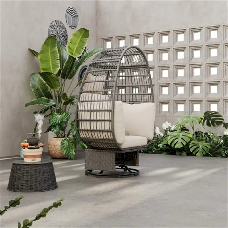 Fauteuil pivotant œuf en rotin pour terrasse, avec coussins et fonction bascule